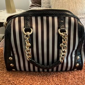 Henri Bendel Bowler Bag, magenta lining in excellent condition.